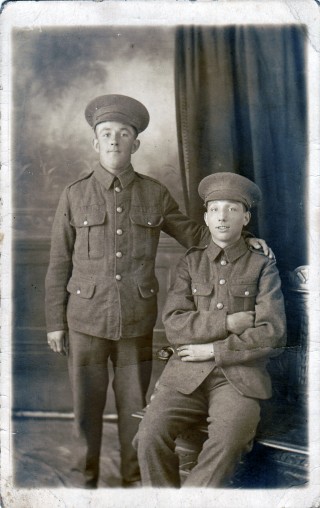 Lionel (seated) and his cousin in their Wiltshire Regiment uniform, 1914