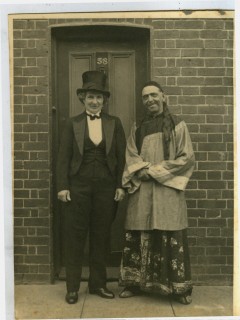 Fred and Maud (Iris' grandparents) standing outside the doorway of 58 Greencroft Street dressed for the Street VE Day fancy dress party. | Iris Evans