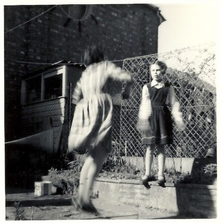 Dad concreted the central part of our garden over and made raised flower beds using bricks that he moulded himself. When we played, we could hear music floating out of Invicta's window, the latter often being left open.