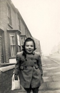 I was about three when this picture was taken. At the time, I was probably walking home from my great aunt's house which can be seen in the background. | Photograph by kind permission of the Jacob family