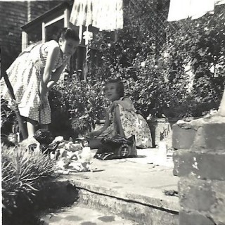 In the 1920s, children could play outside their homes in Rampart Road but, with the increase in traffic, it became too dangerous to do so. In the 1950s, children either played in gardens or went to the designated play areas, this photograph showing the garden of Number 16. | Picture by kind permission of the Jacob family