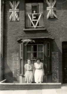The flags on 16 Rampart Road were used again when the street was decorated for the coronation of Elizabeth II. The VE sign, however, was replaced by an illuminated picture of Elizabeth II, the light from the latter keeping us awake at nights! | Photograph by kind permission of the Jacob family