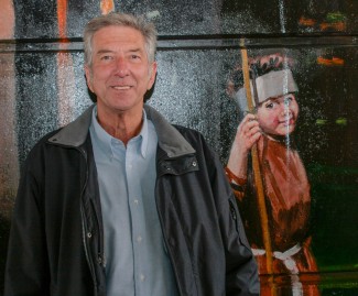 Richard Webb at the official opening of the Jubilee Mural, next to the image of him dressed as Friar Tuck | Anna Tooth