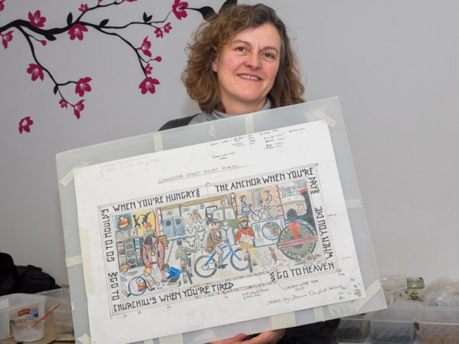 Joanna Dewfall holds up her design for the Winchester Street mosaic | Photo John Palmer