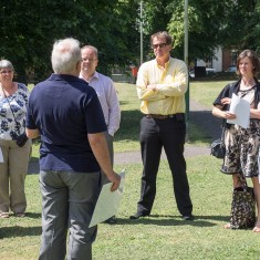 George Fleming describes the Memory Walk to our visitors before taking them to see the mosaic and the murals | John Palmer