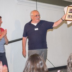 Clare presents George with framed photos of the murals to thank him for his huge contribution to the project, all of which he does voluntarily. | John Palmer