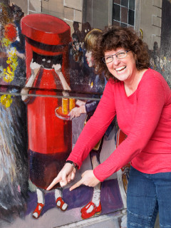 Lisa Parrott, the girl in the pillar box in the Jubilee Mural, admires her former taste in footwear | John Palmer