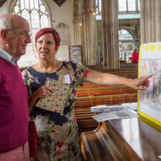 Project Co-ordinator Clare Christopher explains to a visitor what the mosaic is about