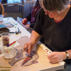 Christine making some lizard-skin shoes | John Palmer