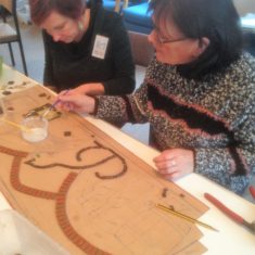 Clare works on bottles in the cellar and Angela works on her beloved cat Billy